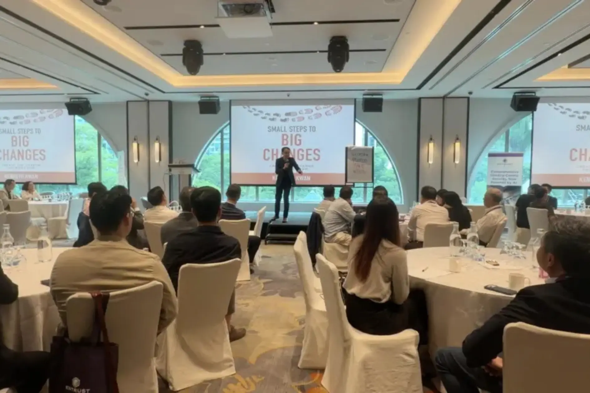 Business keynote speaker Kenneth Kwan delivering a results-focused keynote to corporate leaders