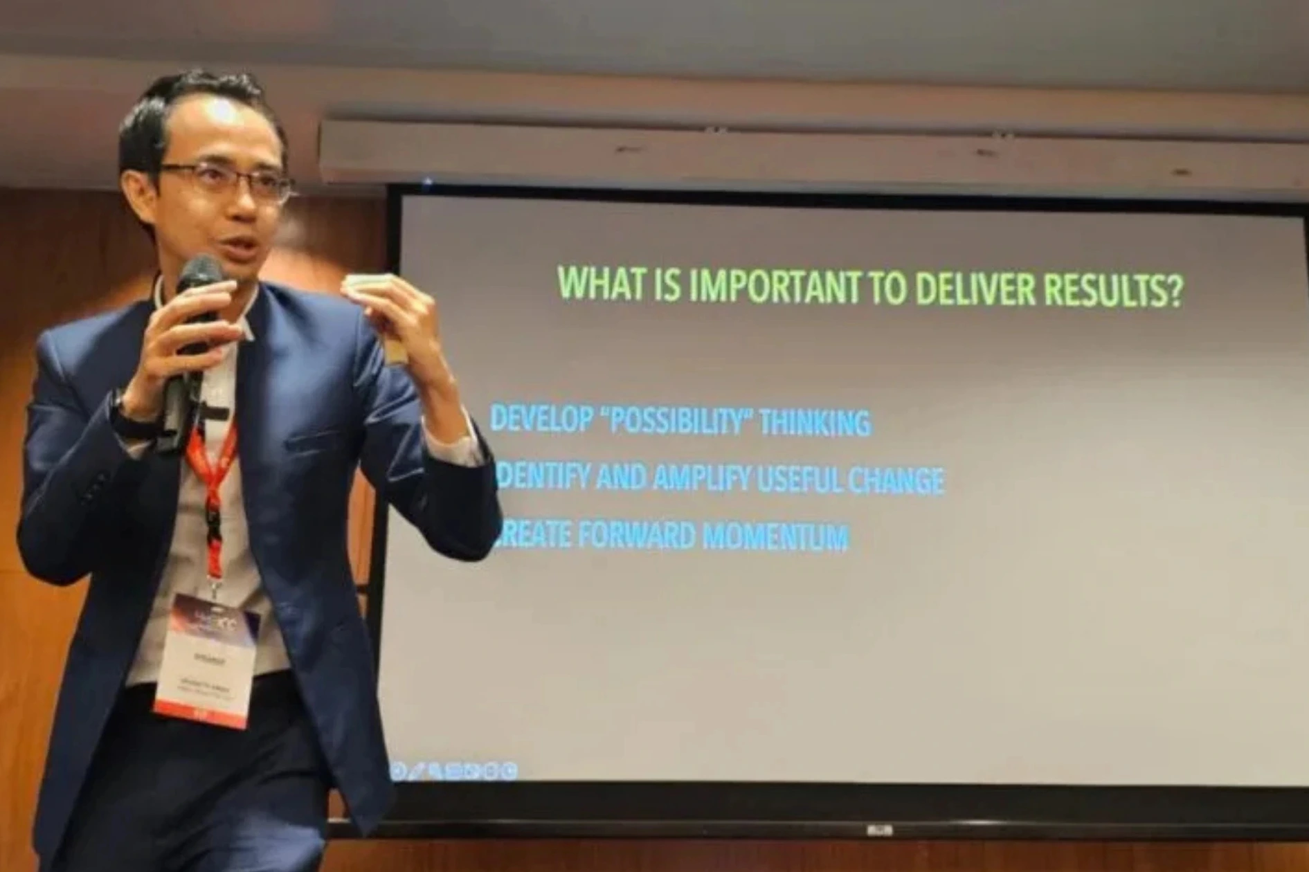 Corporate audience engaging with a leadership keynote in Singapore